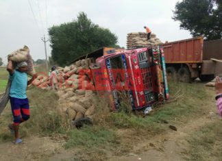 highway robbers try to loot a truck which got imbalance and overturned